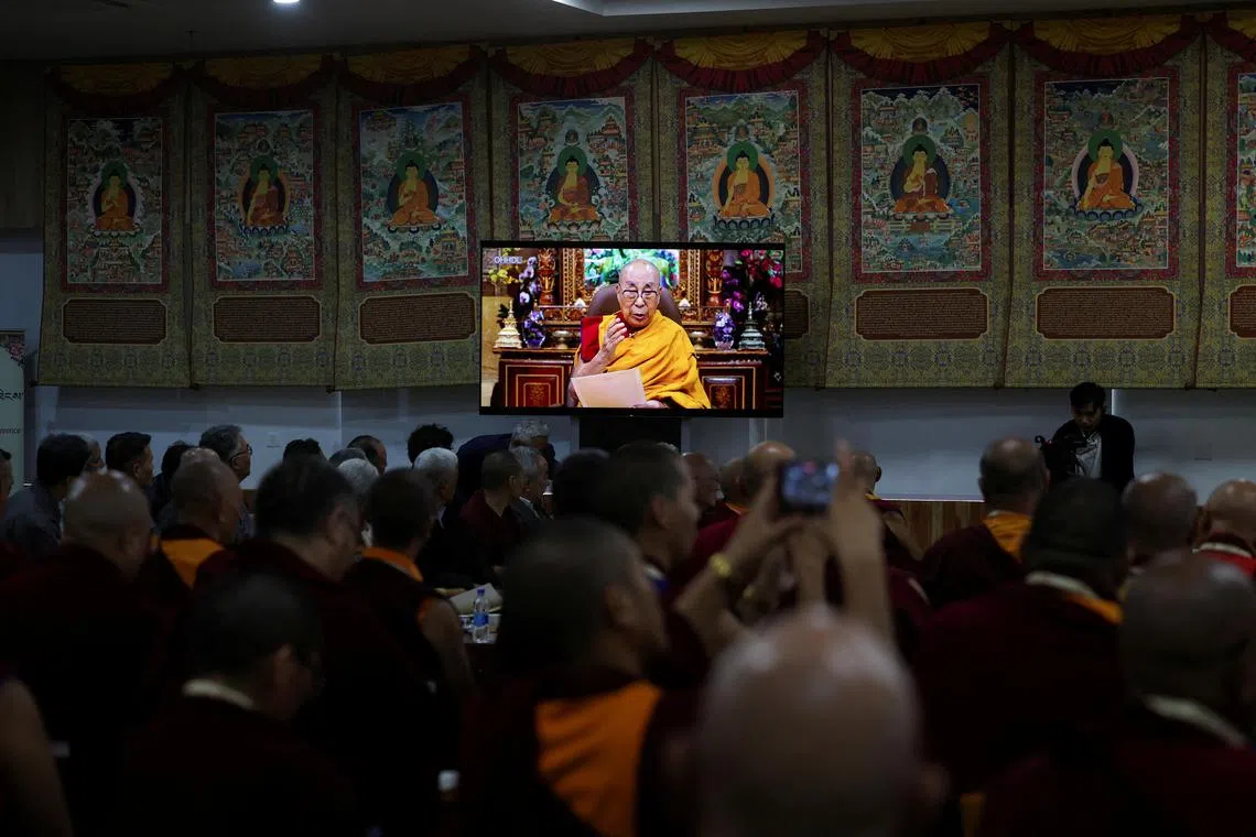 Tibetan spiritual leader the Dalai Lama speaks in a video broadcast at the start of a meeting of religious leaders.