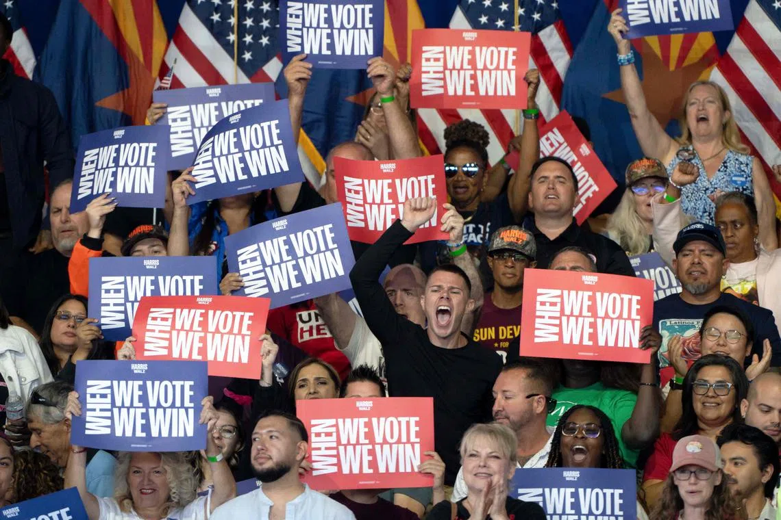 Supporters cheer during a campaign rally for US Vice President and Democratic presidential nominee Kamala Harris at Talking Stick Resort Amphitheatre in Phoenix, Arizona, on Oct 31.