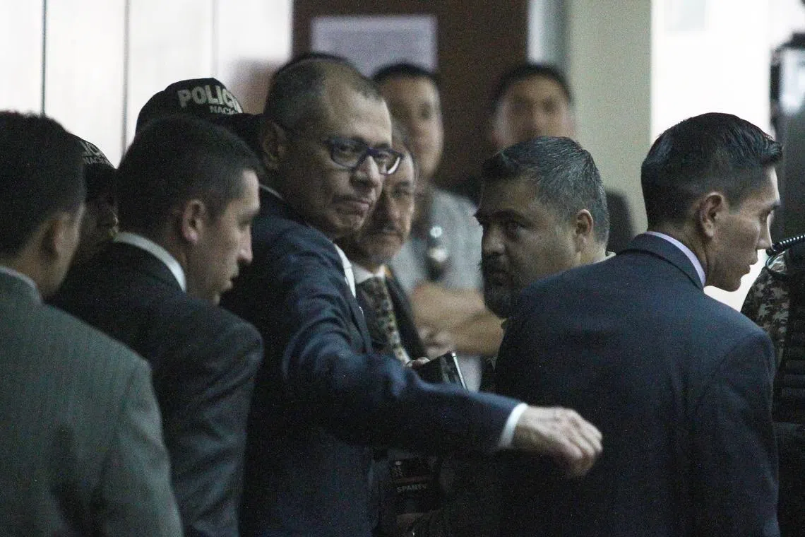 FILE PHOTO: Ecuadorean Vice President Jorge Glas reacts as he arrives to court, to attend his trial on bribery from Brazilian construction company Odebrecht, in Quito, Ecuador, December 13, 2017. REUTERS/Daniel Tapia/File Photo