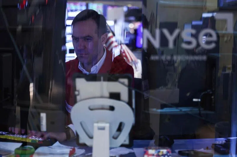 A trader works on the floor of the New York Stock Exchange at the opening bell in New York City on April 7, 2026. 