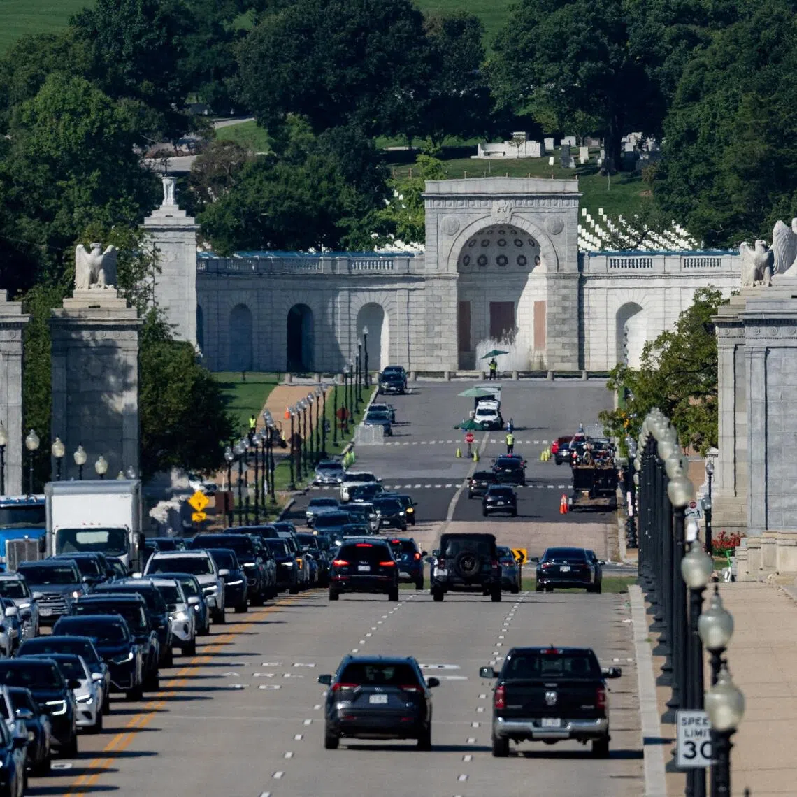 Vehicles drive past along the Memorial Bridge near Memorial Circle in Arlington, Virginia, the proposed site for US President Donald Trump’s “Triumphal Arch”.