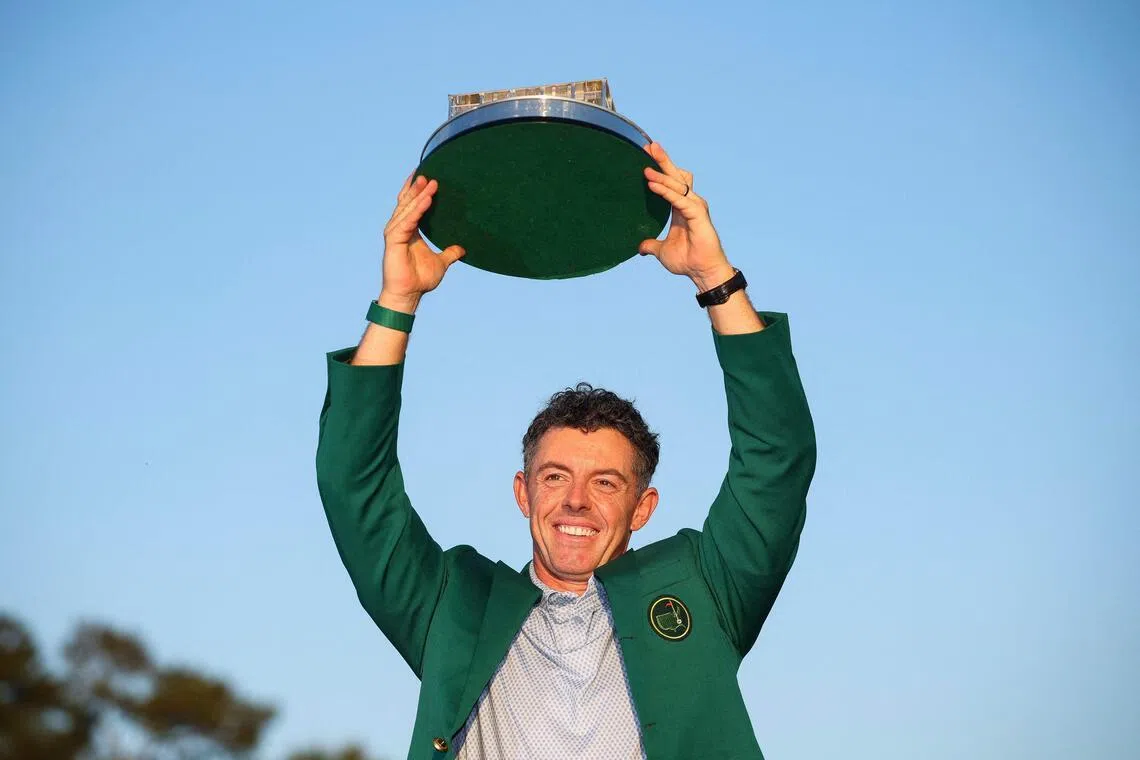 Rory McIlroy lifting the Masters trophy at Augusta National Golf Club on April 12.