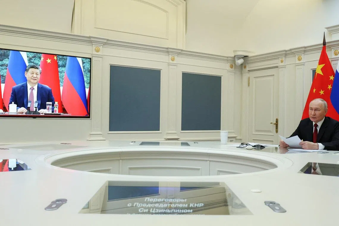 Russia's President Vladimir Putin holds talks with China's President Xi Jinping via video link from Moscow, Russia, on Feb 4.