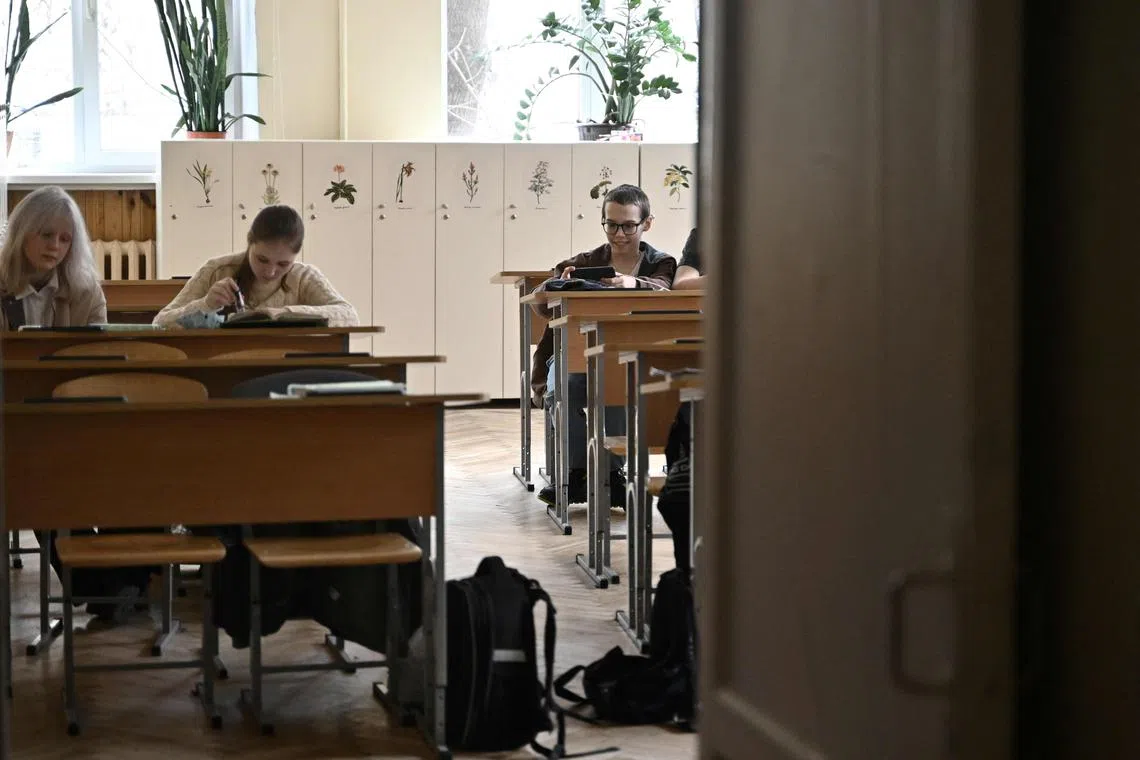School children back in a classroom after an all-clear signal in a school in Kyiv on March 23.