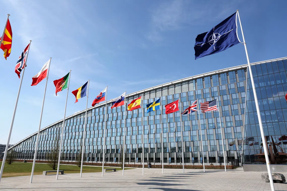 The flags of Nato member states outside its headquarters in Brussels, Belgium. Whatever action the alliance takes against Russian incursions will likely provoke a reaction.