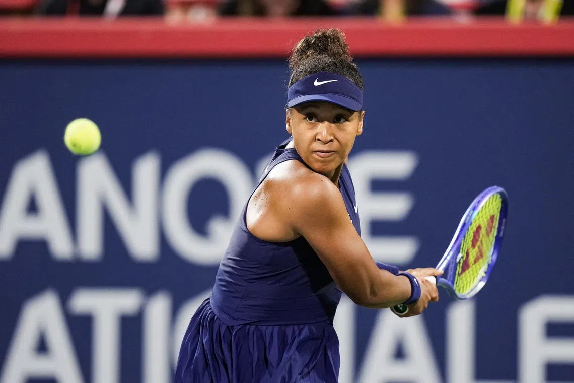Naomi Osaka returns the ball to Elina Svitolina during their match at the WTA Canadian Open.