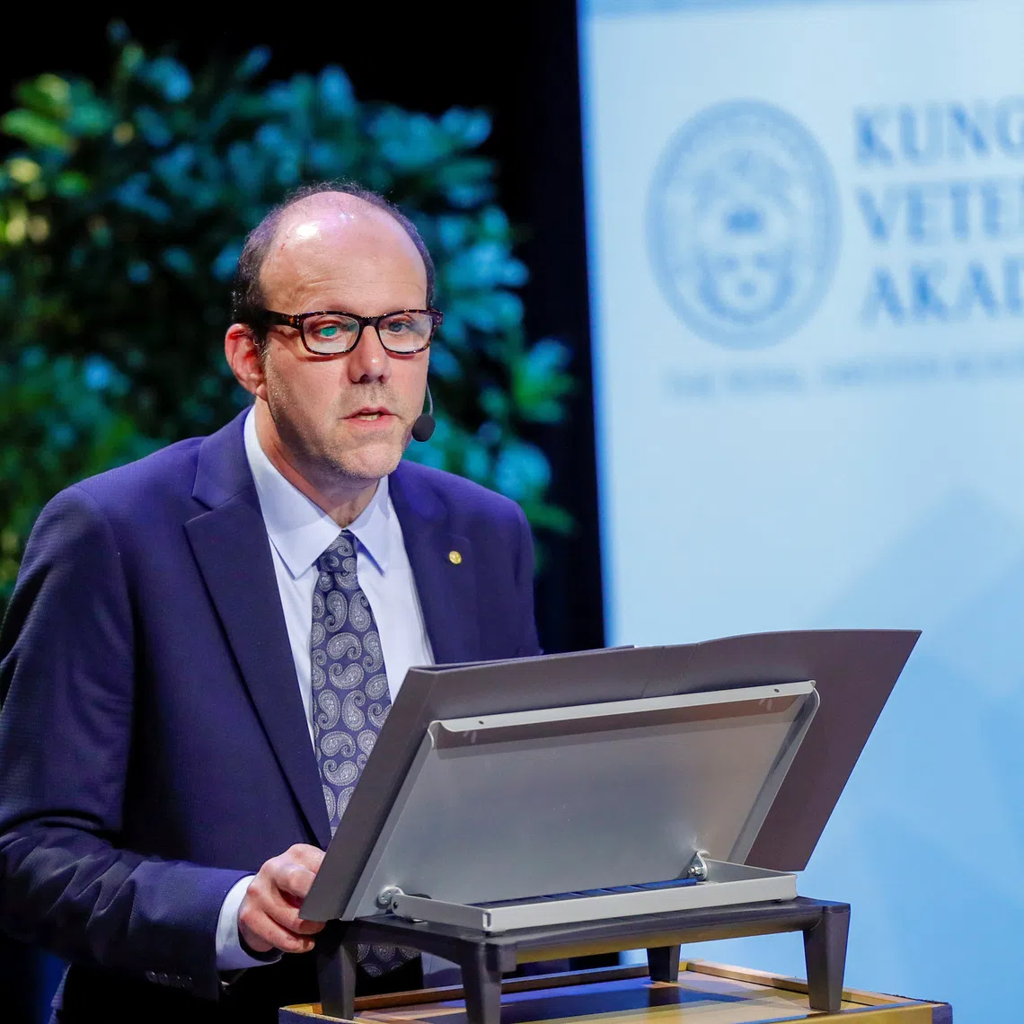 FILE PHOTO: Michael Kremer, Economic Sciences Laureate, The Sveriges Riksbank Prize in Economic Sciences in Memory of Alfred Nobel, speaks during his Nobel lecture \"Experimentation, Innovation and Economics\" at Stockholm University in Stockholm, Sweden December 8, 2019. TT News Agency/Christine Olsson via REUTERS/ File Photo