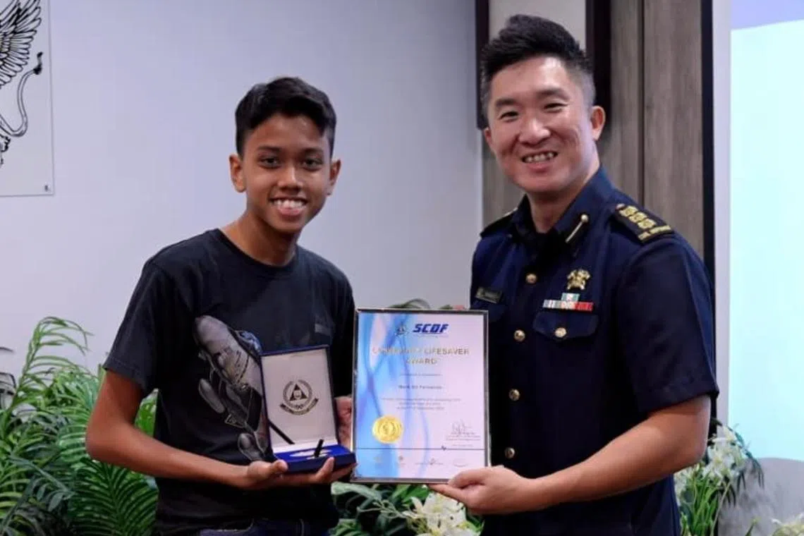 15-year-old Mark Eli Fernando (left) on Sept 7 was alerted to a cardiac arrest incident in his vicinity by the Singapore Civil Defence Force myResponder app.