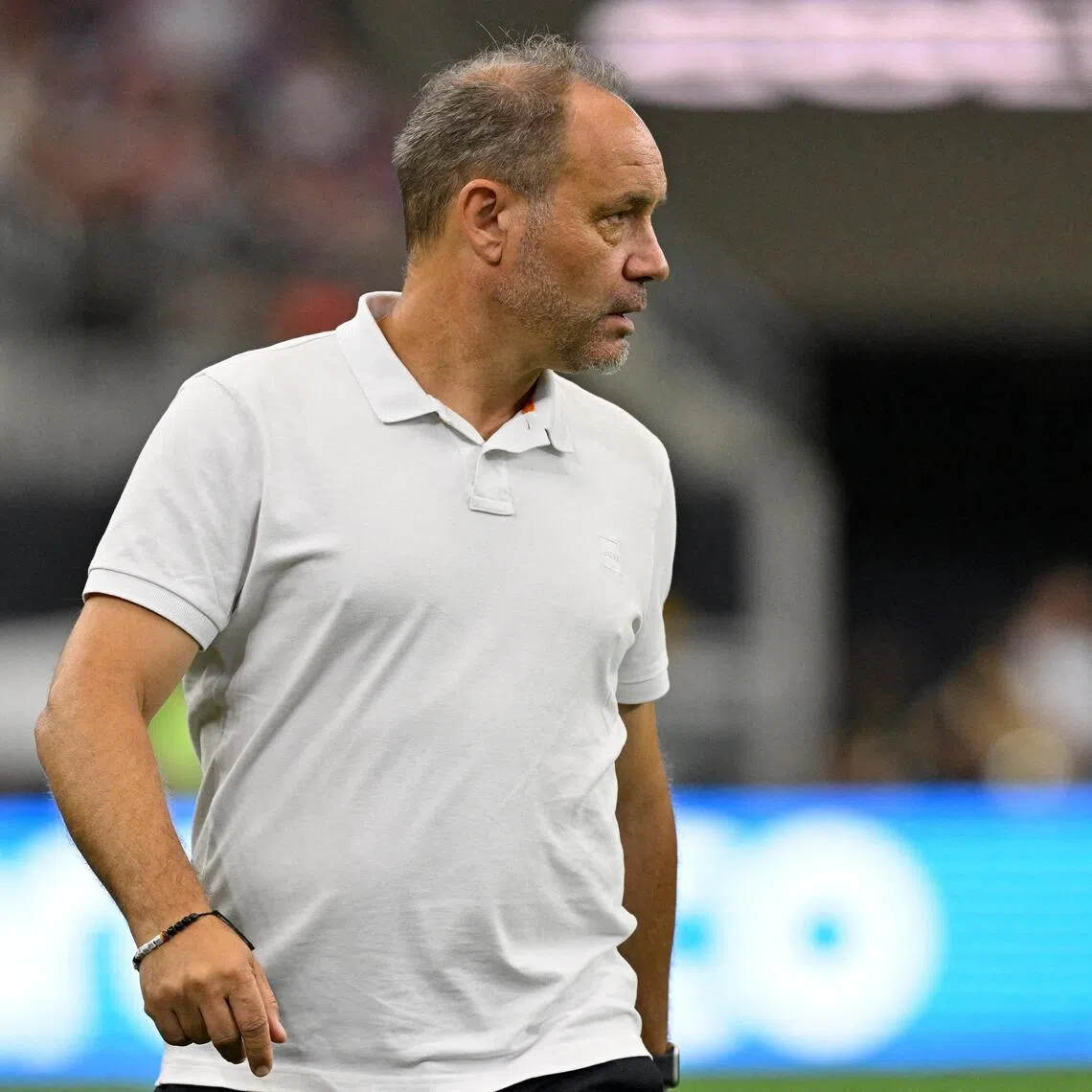 Haiti head coach Sebastien Migne has never set foot in Haiti since being appointed 18 months ago.