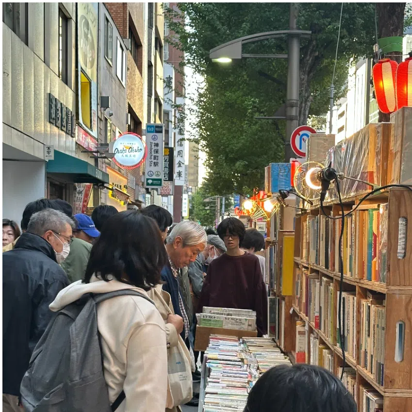 Visitors browsing books and other paper objects at the 65th Kanda Used Book Festival in Jimbocho. 