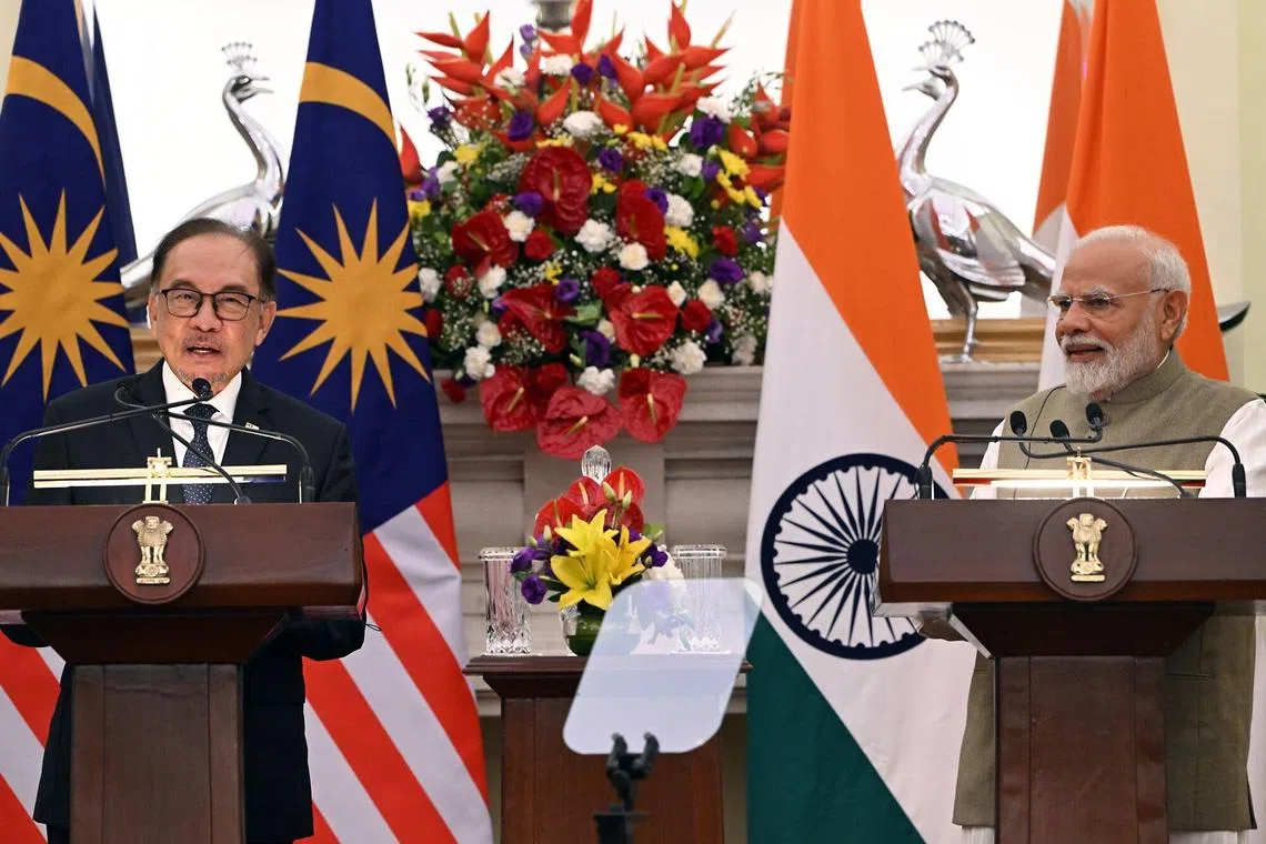 Narendra Modi, India's prime minister (right) and Anwar Ibrahim, Malaysia's prime minister, during a news conference in New Delhi, India.