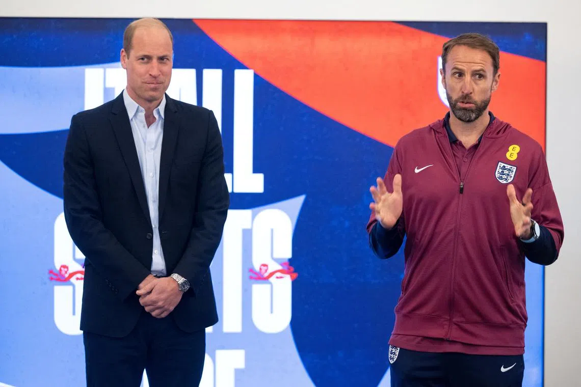 Prince William looks on as England's manager Gareth Southgate gestures during William's visit to England Euro squad at their Burton upon Trent training center, Britain, June 10, 2024. Paul Cooper/Pool via REUTERS
