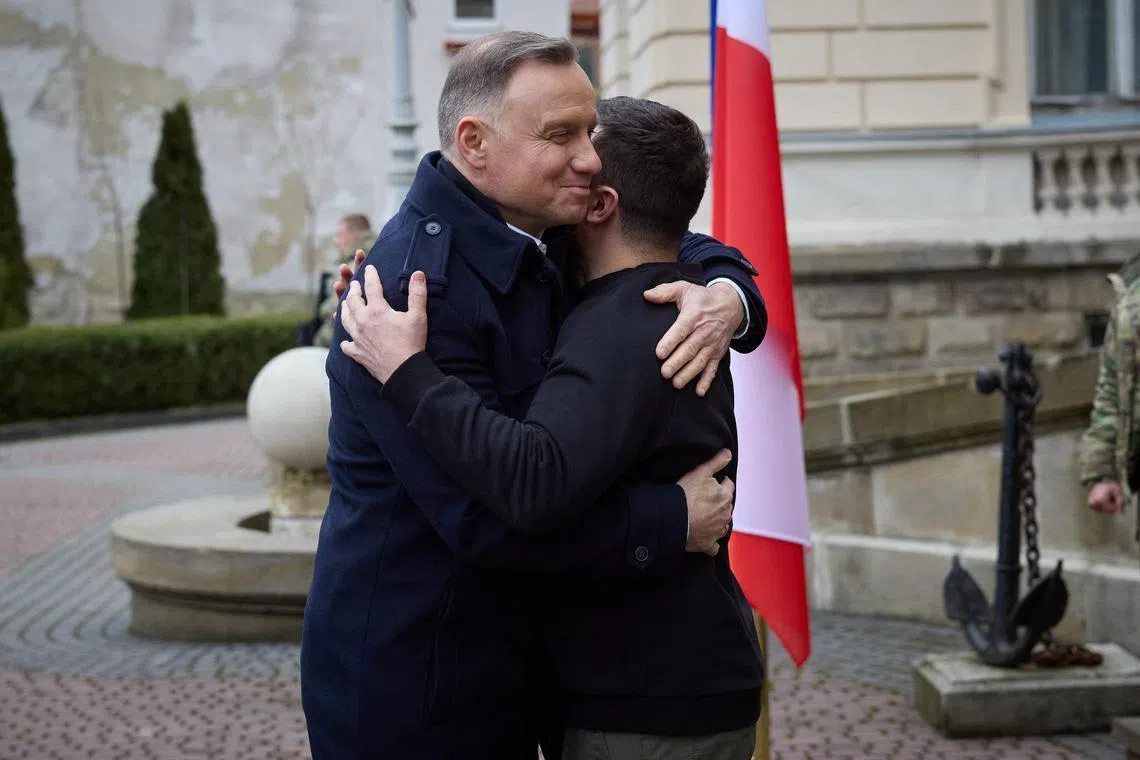 Ukrainian President Volodymyr Zelensky (right) welcomes Polish counterpart Andrzej Duda, in Lviv, on Jan 11, 2022.