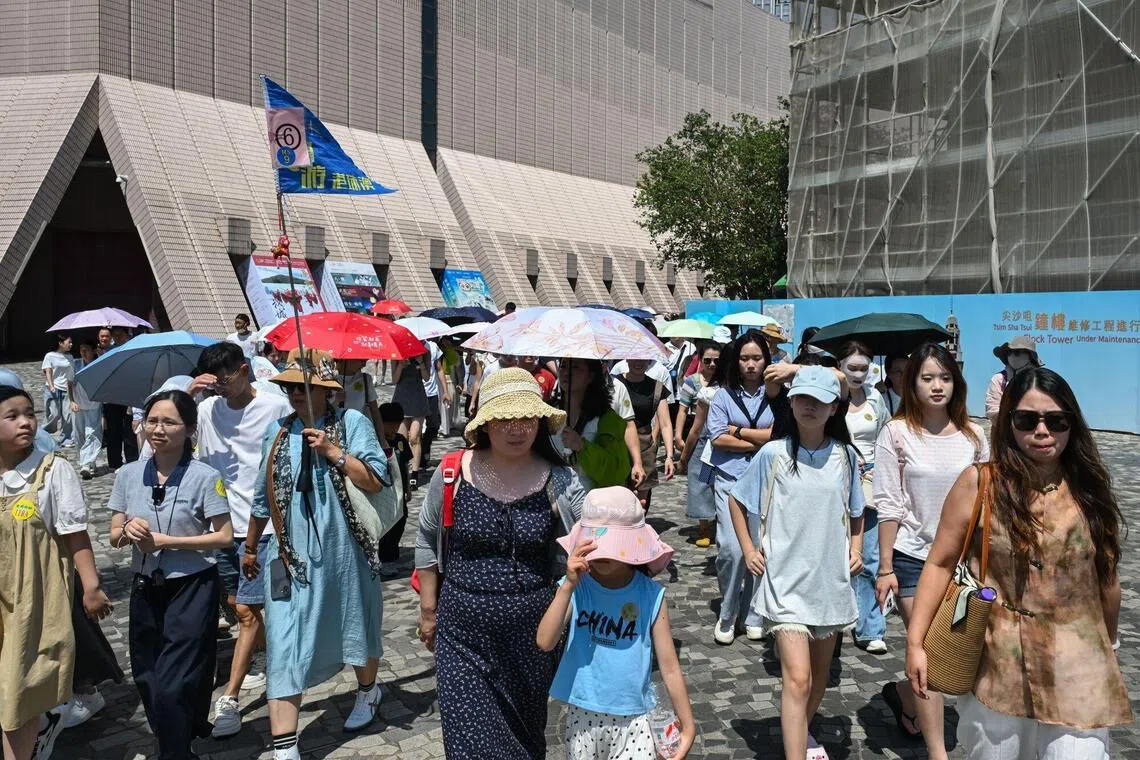 Chinese tourists pull back on overseas trips amid economic gloom