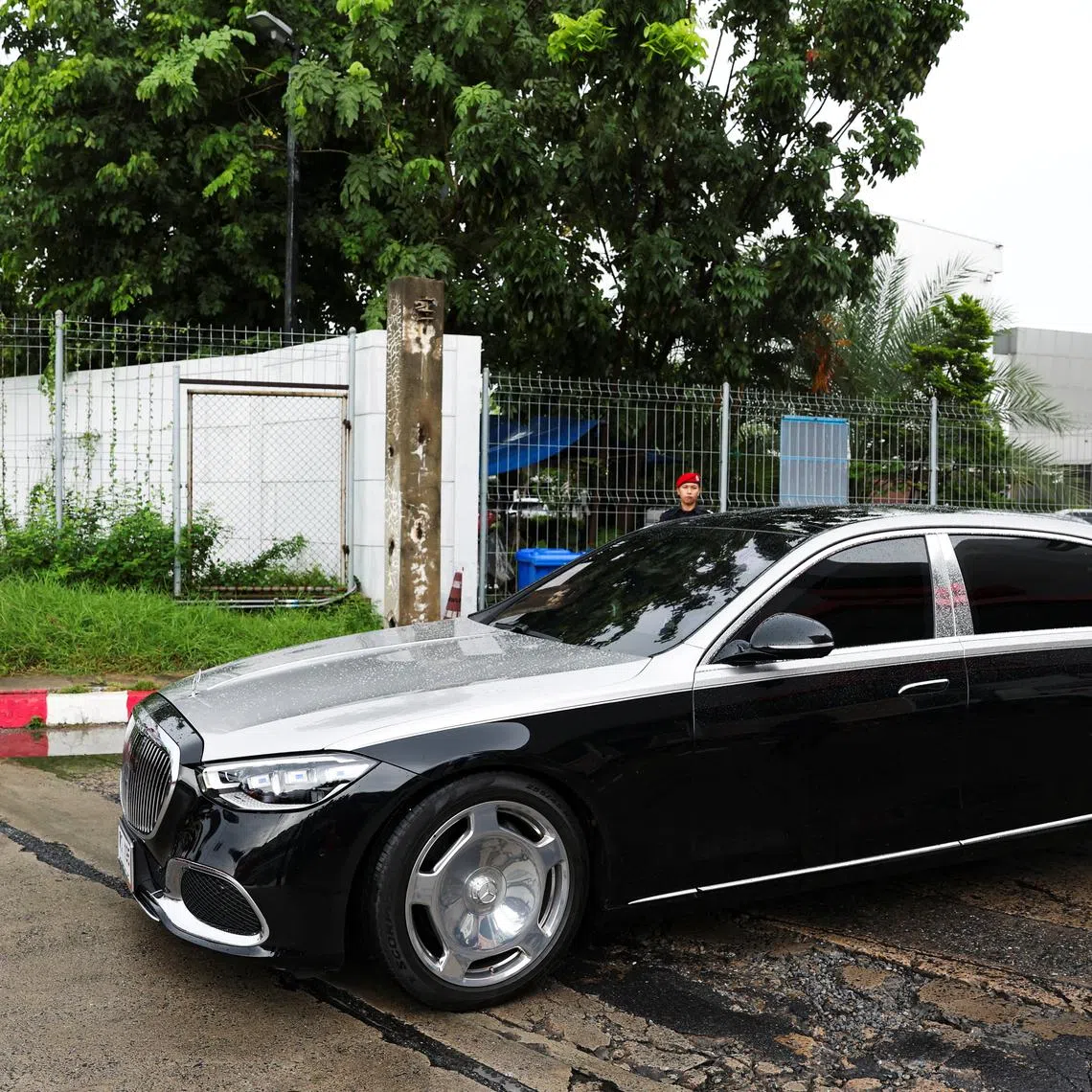 A car in the motorcade believed to be carrying Thailand's former Prime Minister Thaksin Shinawatra drives by after leaving a private jet terminal at Bangkok's Don Mueang International Airport, after he flew out of the country for what he claimed was a medical check-up in Dubai ahead of a key court case, in Bangkok, Thailand, September 8, 2025. REUTERS/Chalinee Thirasupa