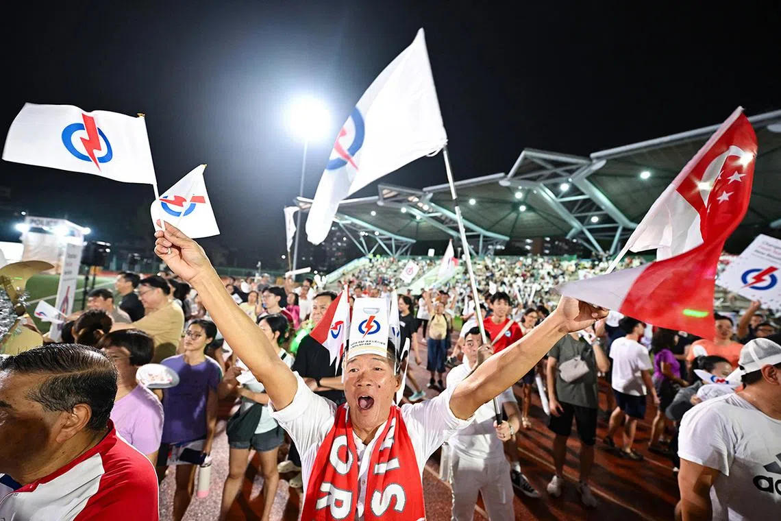 MAIN PIX ST20250501-202599000341-Lim Yaohui-Isabelle Liew-ilrally01/ Mr Barry Ong, 57, Lifeguard, cheering for Dr Faisal Abdul Aziz, PAP candidate for Aljunied GRC, when he is speaking at the rally at Serangoon stadium on May 1, 2025. (ST PHOTO: LIM YAOHUI)