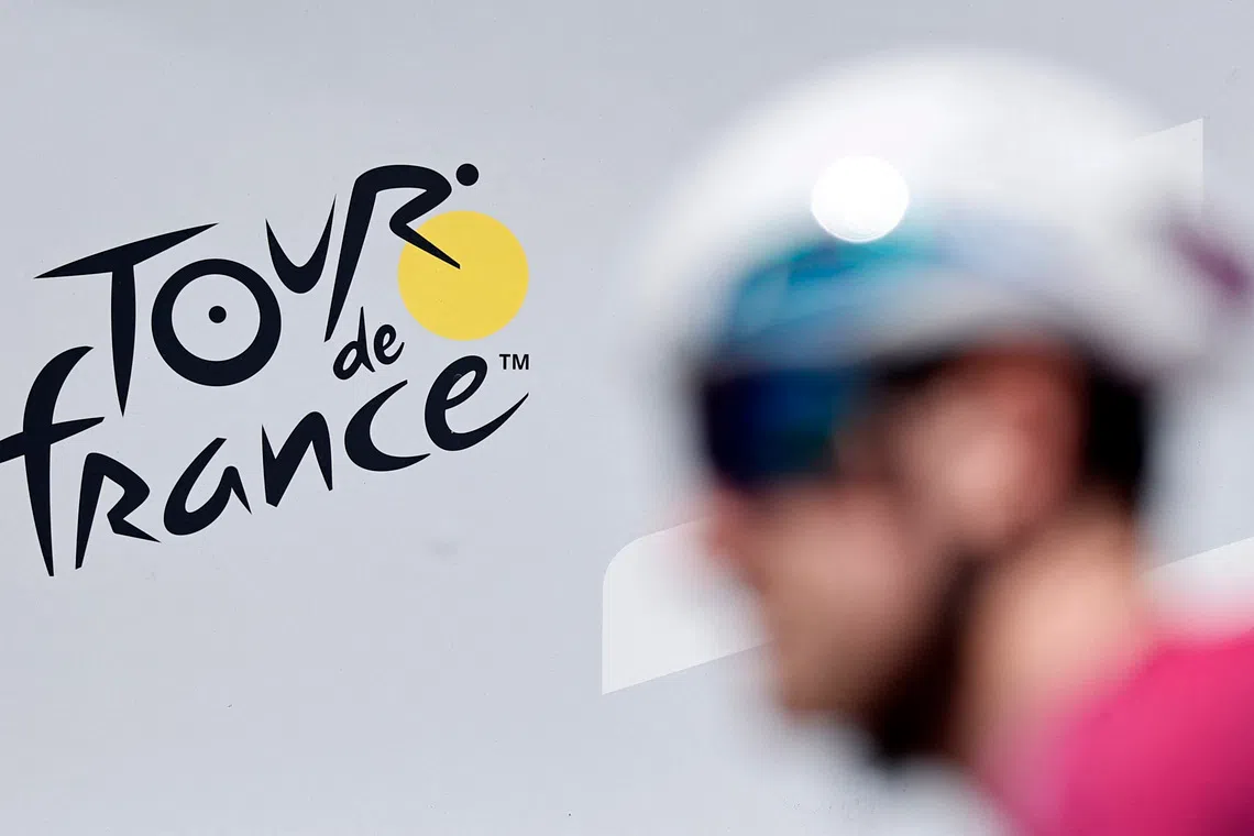 Cycling - Tour de France - Stage 11 - Toulouse to Toulouse - Toulouse, France - July 16, 2025 Israel - Premier Tech's Joseph Blackmore goes by the Tour de France logo before stage 11 REUTERS/Benoit Tessier