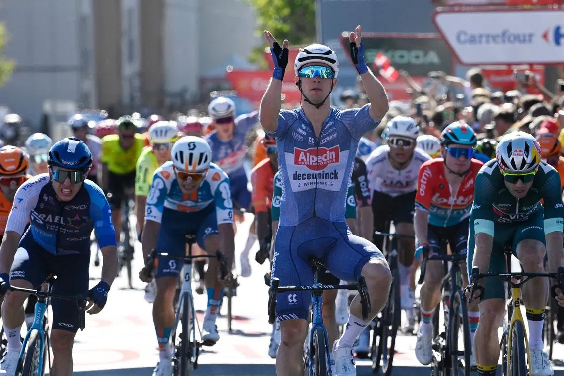 Team Alpecin's Kaden Groves celebrates crossing the finish line first, followed by Team Visma's Wout van Aert (right) and Team Israel Premier Tech's Corbin Strong (left), at the end of the stage 2 of La Vuelta a Espana cycling tour – a 194km ride from Cascais to Ourem, on Aug 18, 2024.