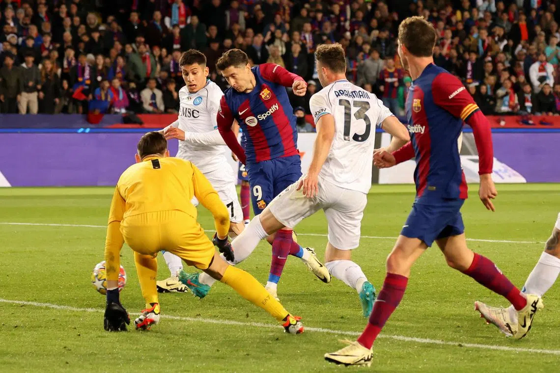 Soccer Football - Champions League - Round of 16 - Second Leg - FC Barcelona v Napoli - Estadi Olimpic Lluis Companys, Barcelona, Spain - March 12, 2024 FC Barcelona's Robert Lewandowski scores their third goal REUTERS/Nacho Doce