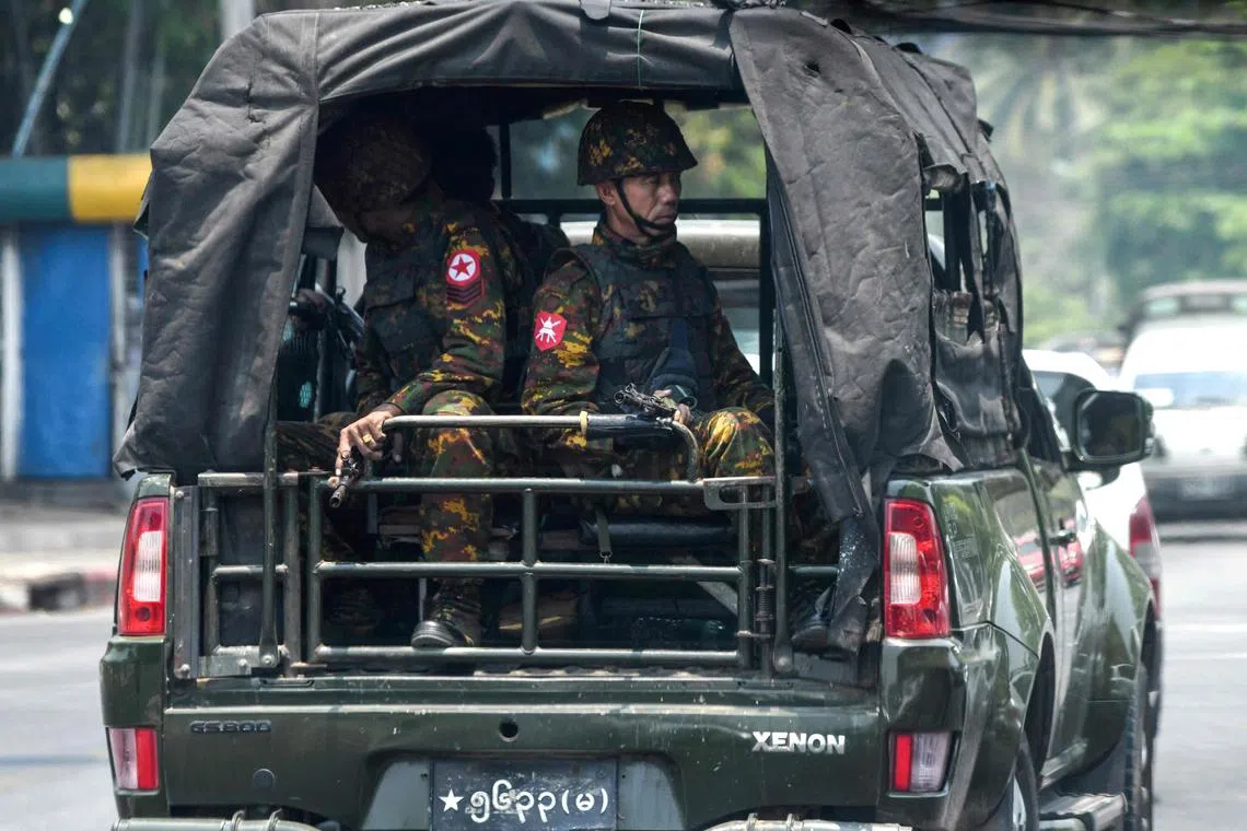 Members of the Myanmar army patrol during the Myanmar's New Year water festival, locally known as Thingyan, in Yangon on April 13, 2023. (Photo by AFP)