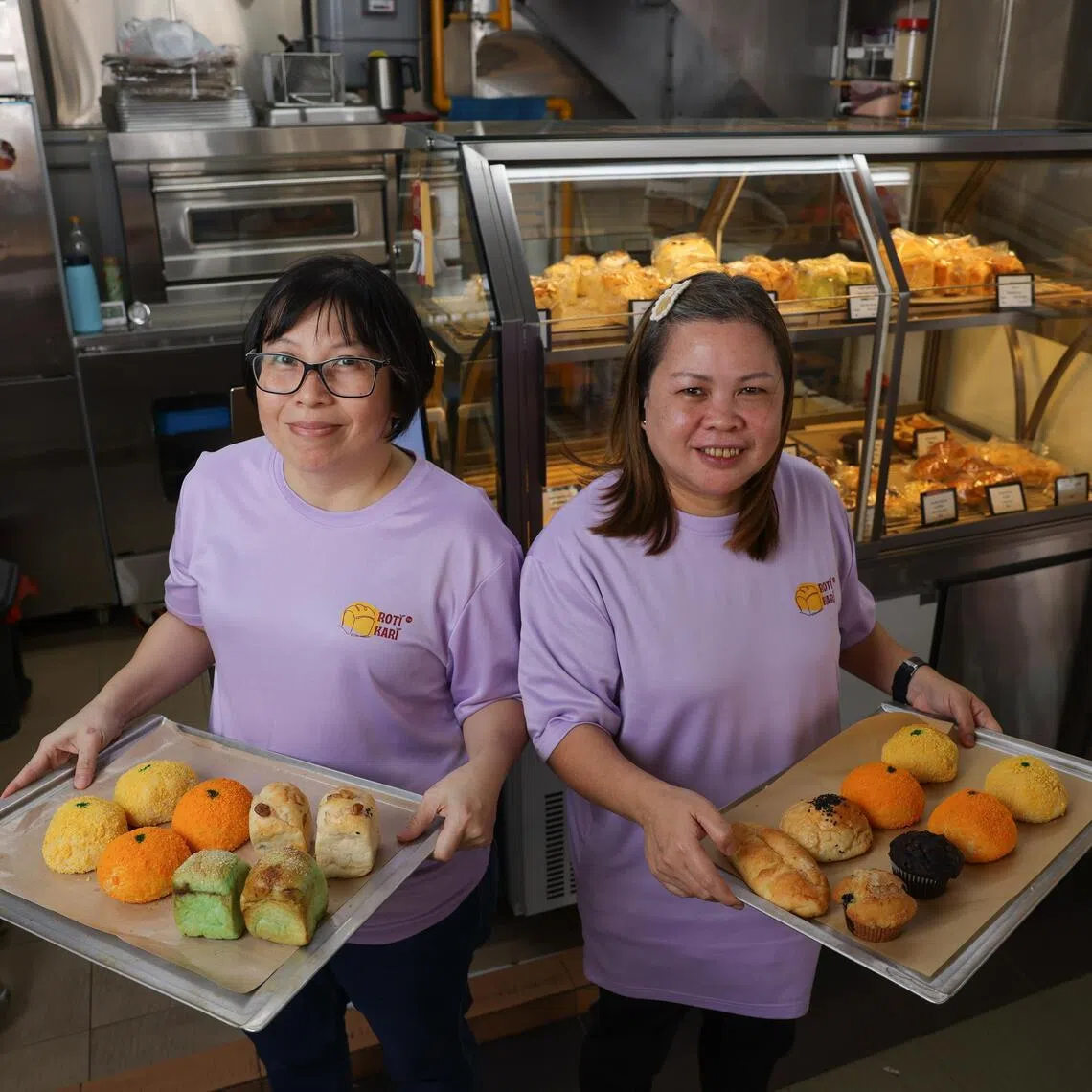 Ex-convicts Yun Li Hua (left), 45 and Chris Wong, 52, manning a bread stall, Roti Kari. To create employment for female ex-offenders, a charity called Blessed Grace Social Services has partnered an F&B Group to run hawker stalls hiring the women ex-convicts. The women get paid a salary and some profit sharing for running these stalls selling bread. 