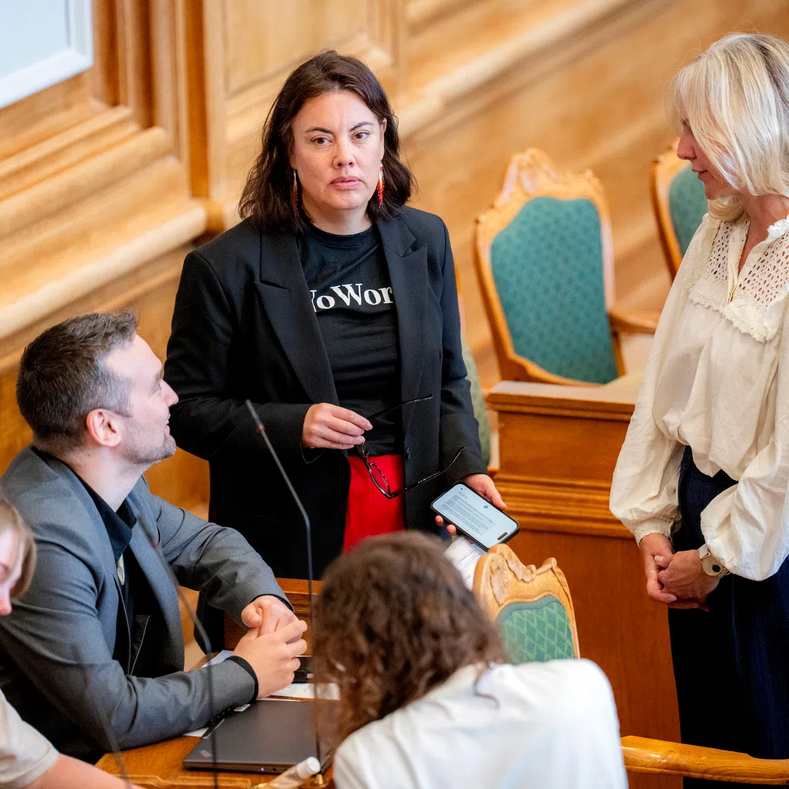 Greenlandic MPs and Danish Minister of Health and Church Affairs Ida Auken (right) attending a meeting of the Danish Parliament, in Copenhagen, Denmark, on Aug 27.