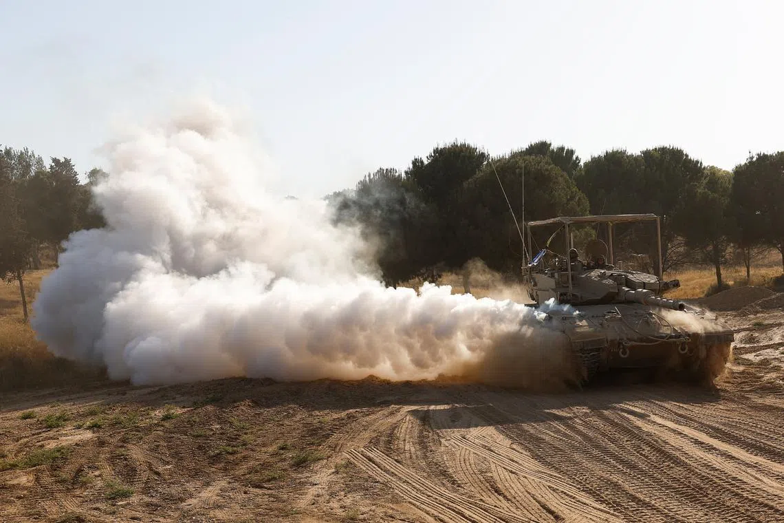 An Israeli tank manoeuvres, after returning from the Gaza Strip, amid the ongoing conflict between Israel and Hamas, near the Israel-Gaza border, in Israel, June 5, 2024. REUTERS/Amir Cohen