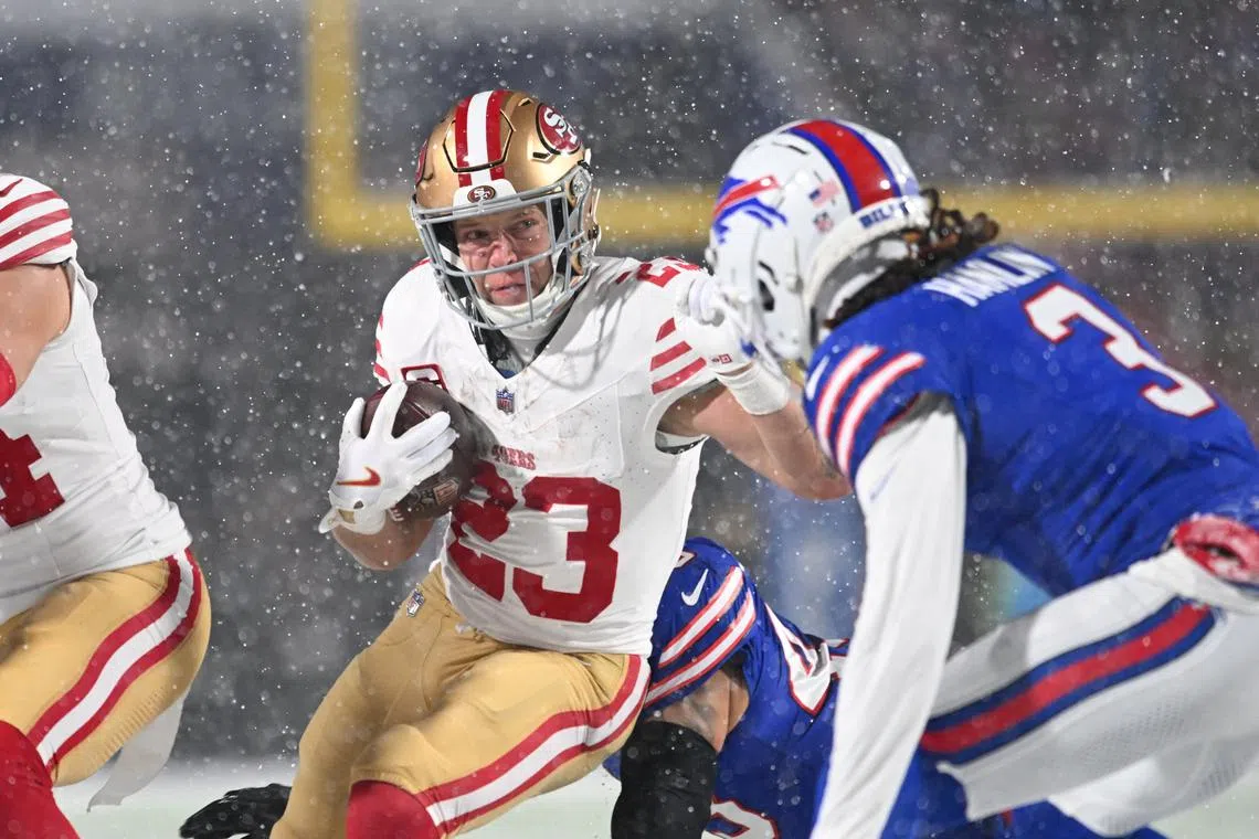 Dec 1, 2024; Orchard Park, New York, USA; San Francisco 49ers running back Christian McCaffrey (23) tries to avoid Buffalo Bills safety Damar Hamlin (3) on a run in the first quarter at Highmark Stadium. Mandatory Credit: Mark Konezny-Imagn Images/ File Photo