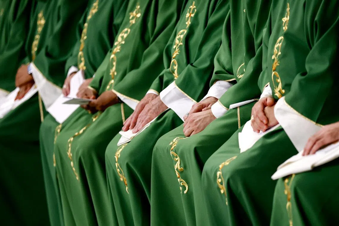 Bishops sit as Pope Francis presides over the closing Mass at the end of the Synod of Bishops in Saint Peter's Basilica at the Vatican, October 29, 2023. 