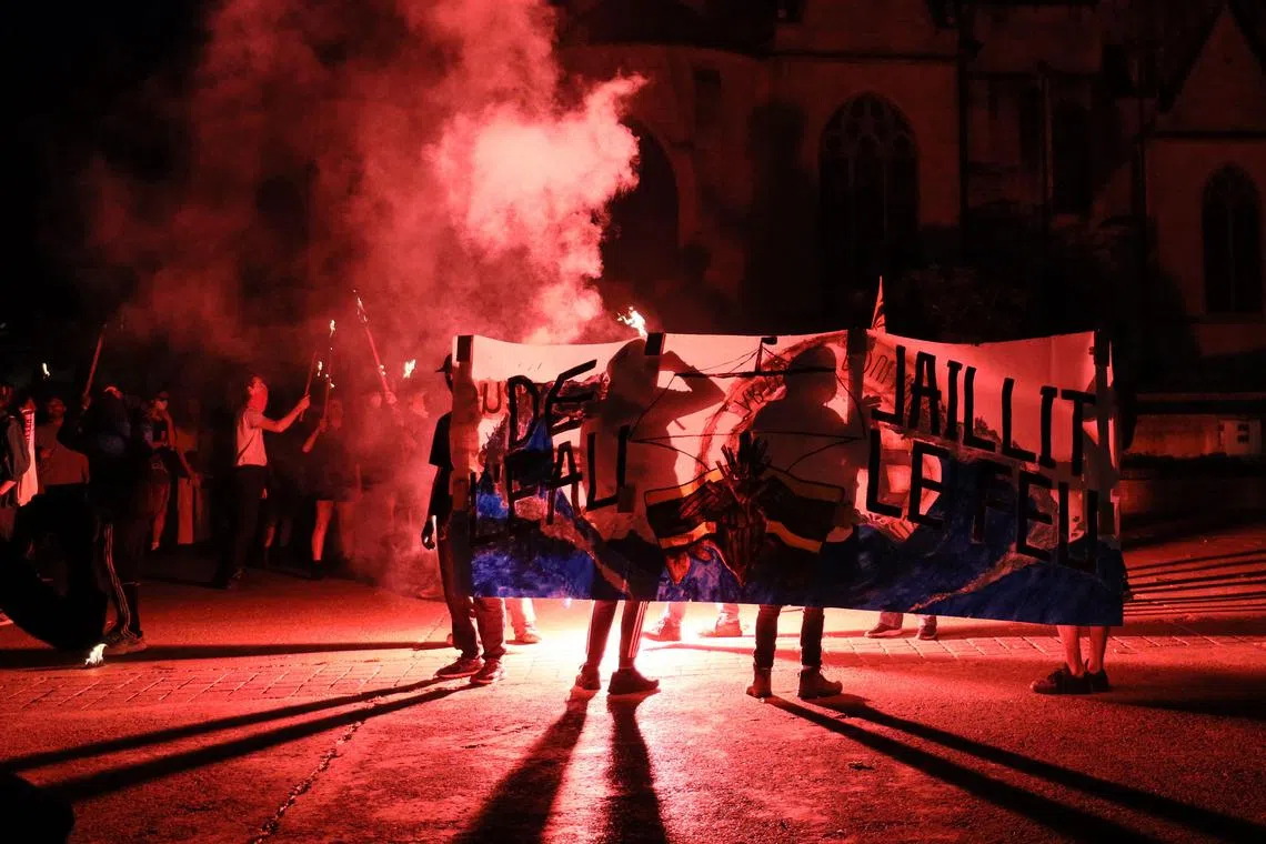 Protestors demonstrate against government's pension reforms and a water basin project near Sainte-Soline, in Poitiers, western France, on June 2.