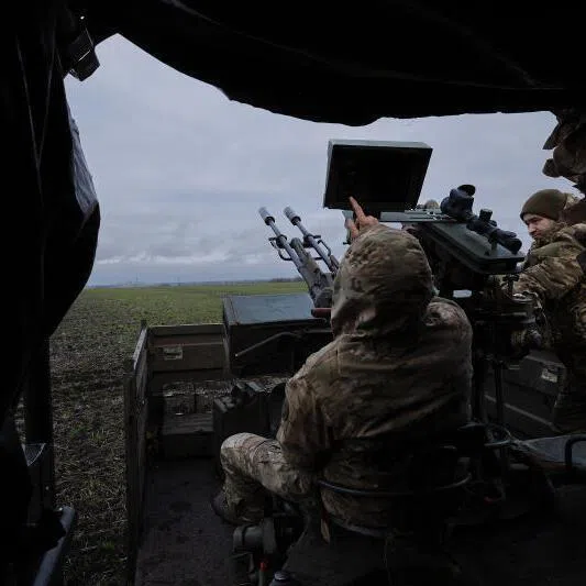 A Ukrainian soldier with an anti-aircraft gun used to target Russian drones in the Donetsk region of Ukraine, on Dec 22, 2025.