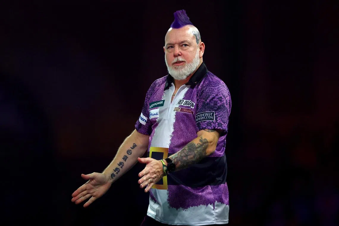 Former winner Peter Wright reacting during the PDC World Darts Championship at Alexandra Palace in London.