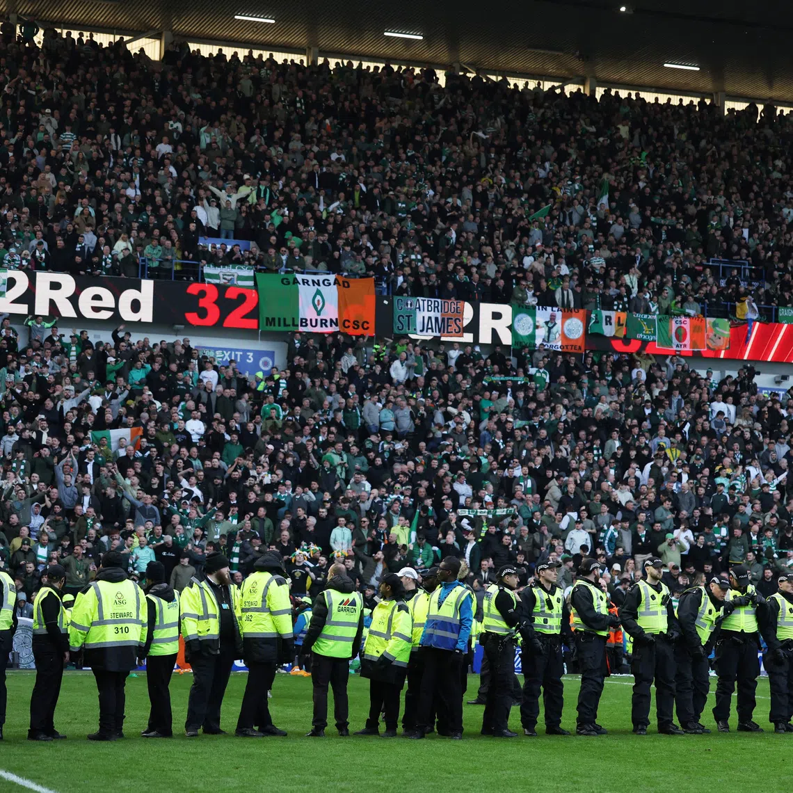 FILE PHOTO: Soccer Football - Scottish League Cup - Quarter Final - Rangers v Celtic - Ibrox, Glasgow, Scotland, Britain - March 8, 2026 General view of police officers on the pitch after the match REUTERS/Russell Cheyne/File Photo