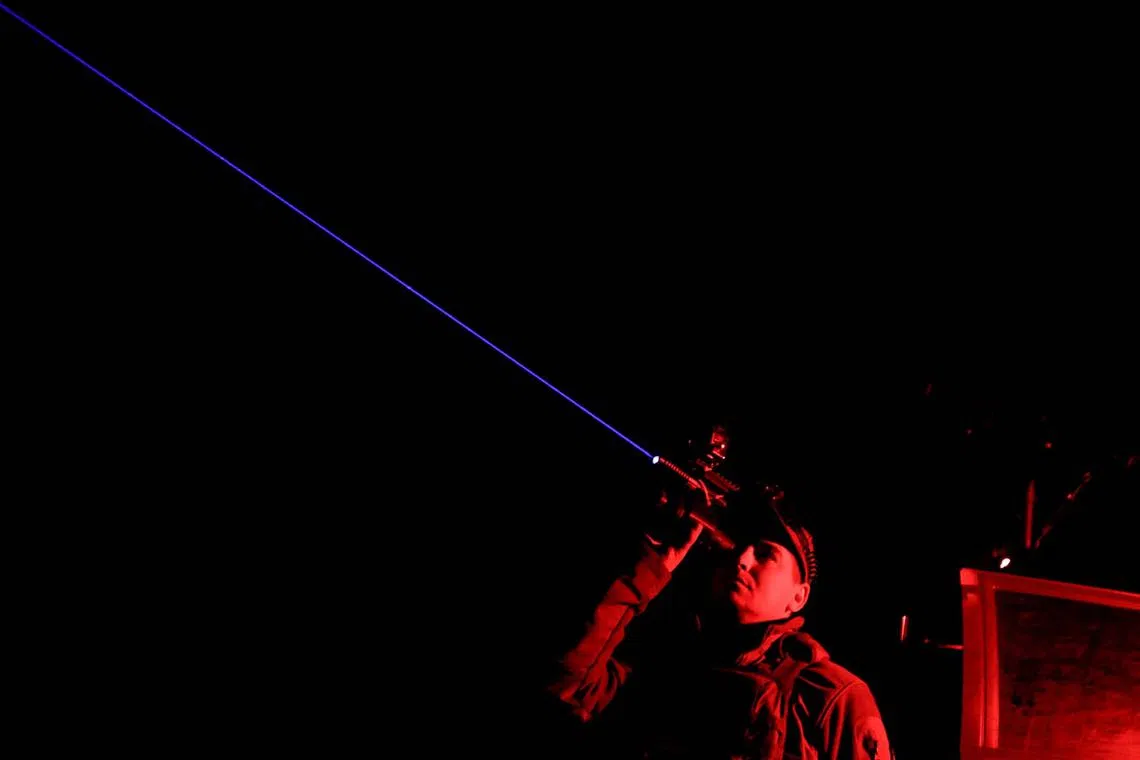 A serviceman from the mobile air defence unit of the Ukrainian Armed Forces observing the sky during an overnight shift, amid Russia's attack on Ukraine, in Kharkiv Region, Ukraine, June 1, 2025. 