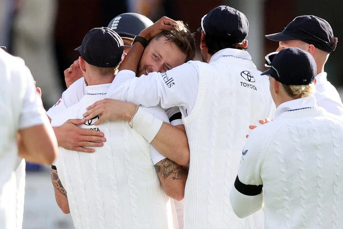 Cricket - England v New Zealand - First Test - Lord's Cricket Ground, London, Britain - June 4, 2026 England's Ollie Robinson celebrates after taking the wicket of New Zealand's Daryl Mitchell with teammates Action Images via Reuters/Andrew Boyers