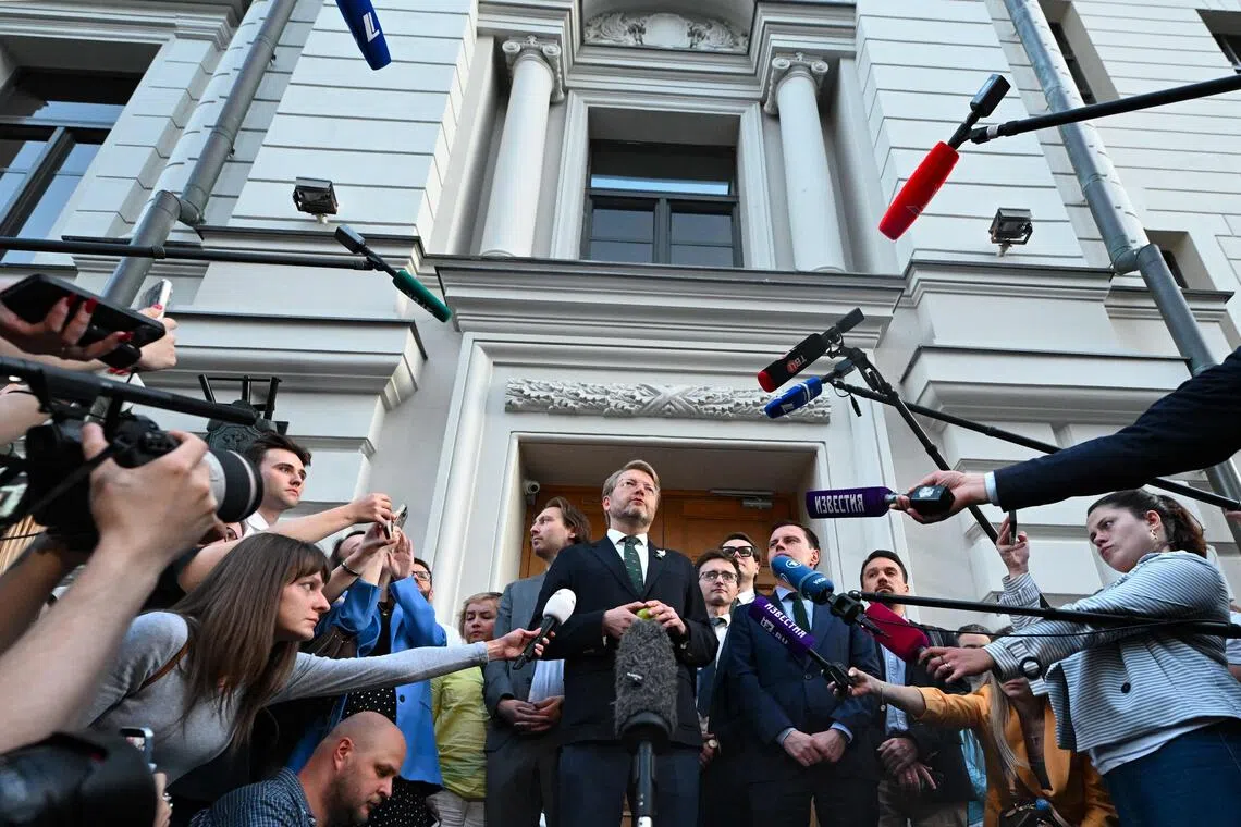 abloko party leader Nikolay Rybakov talking to the media in Moscow on Aug 10, after his party was barred from taking part in Russia’s September election.