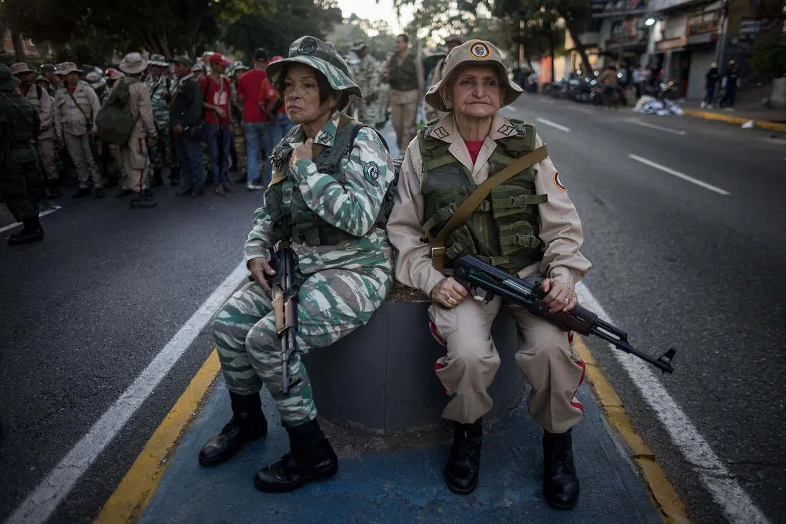 Members of the Bolivarian militias participating in a swearing-in ceremony in Caracas, Venezuela, Jan 7, 2025. 
