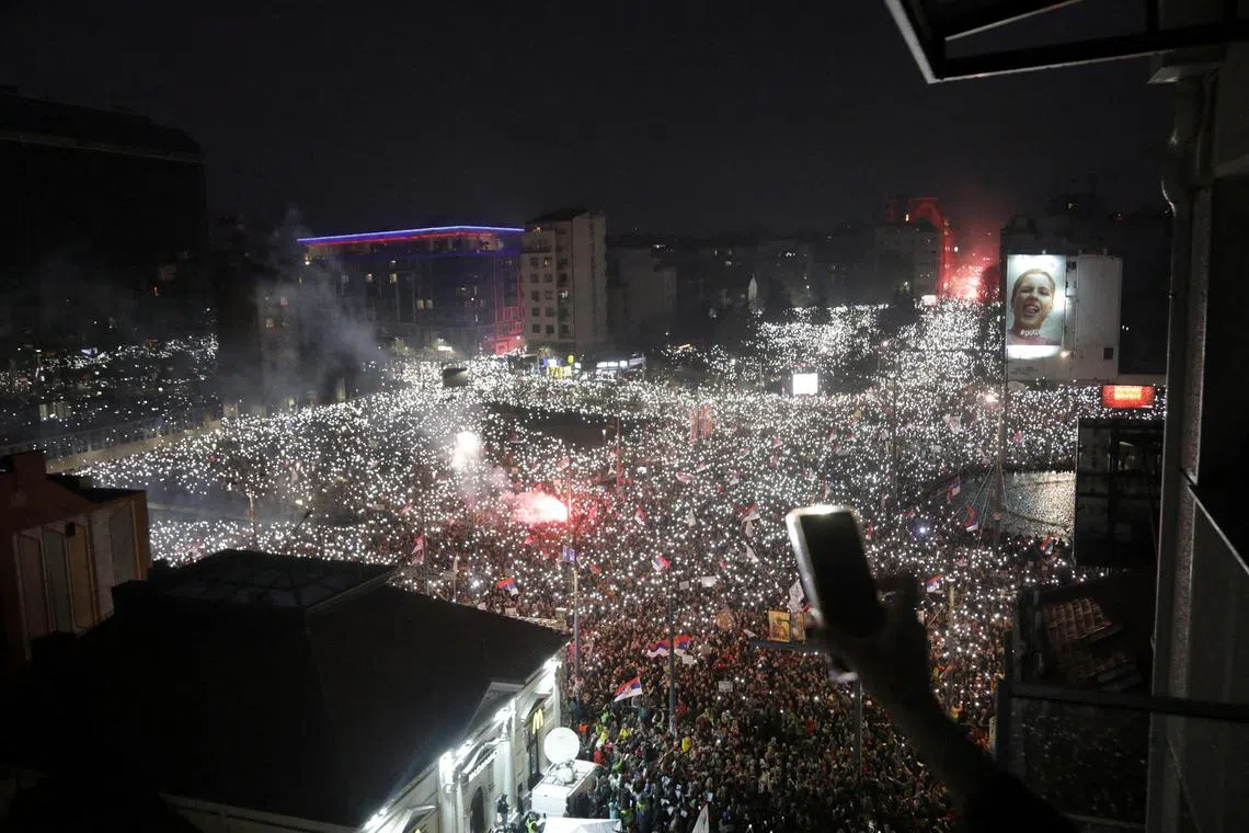 Protesters using the flashlights on their cellphones during the protest in Belgrade, on March 15.