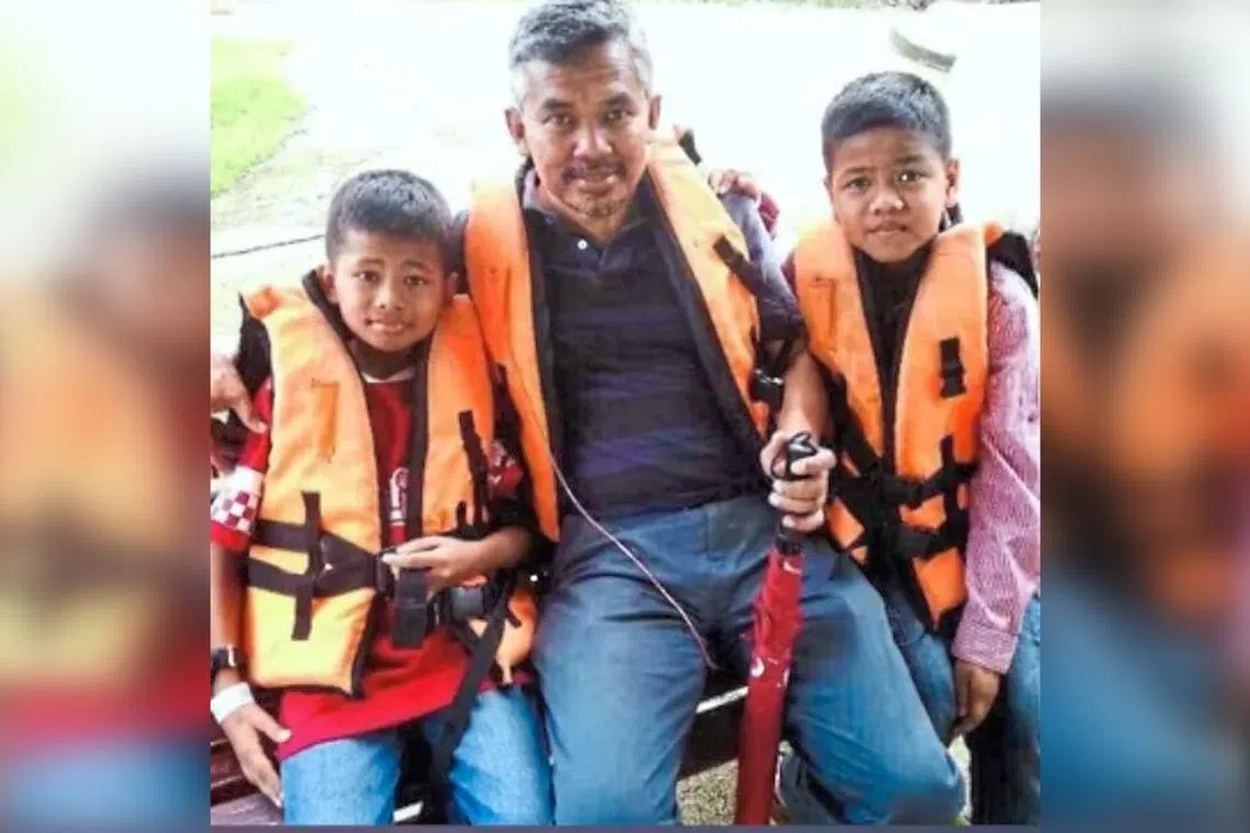 Mr Wan Yusuf Irfan (left) on vacation with his late father Wan Amran (middle) and brother Wan Uzair in this old photo courtesy of the boys’ mother.