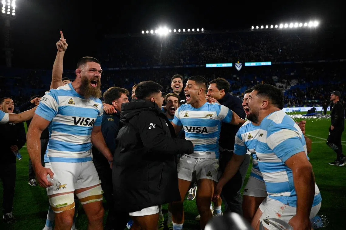Argentina's Los Pumas players celebrating after winning their 29-23 Rugby Championship 2025 win over New Zealand at the Jose Amalfitani Stadium in Buenos Aires on Aug 23, 2025.