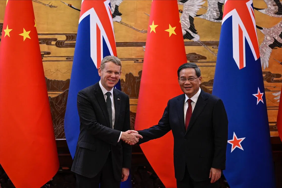 New Zealand PM Chris Hipkins (left) is in China to drum up business and help his nation exit an election-year recession.