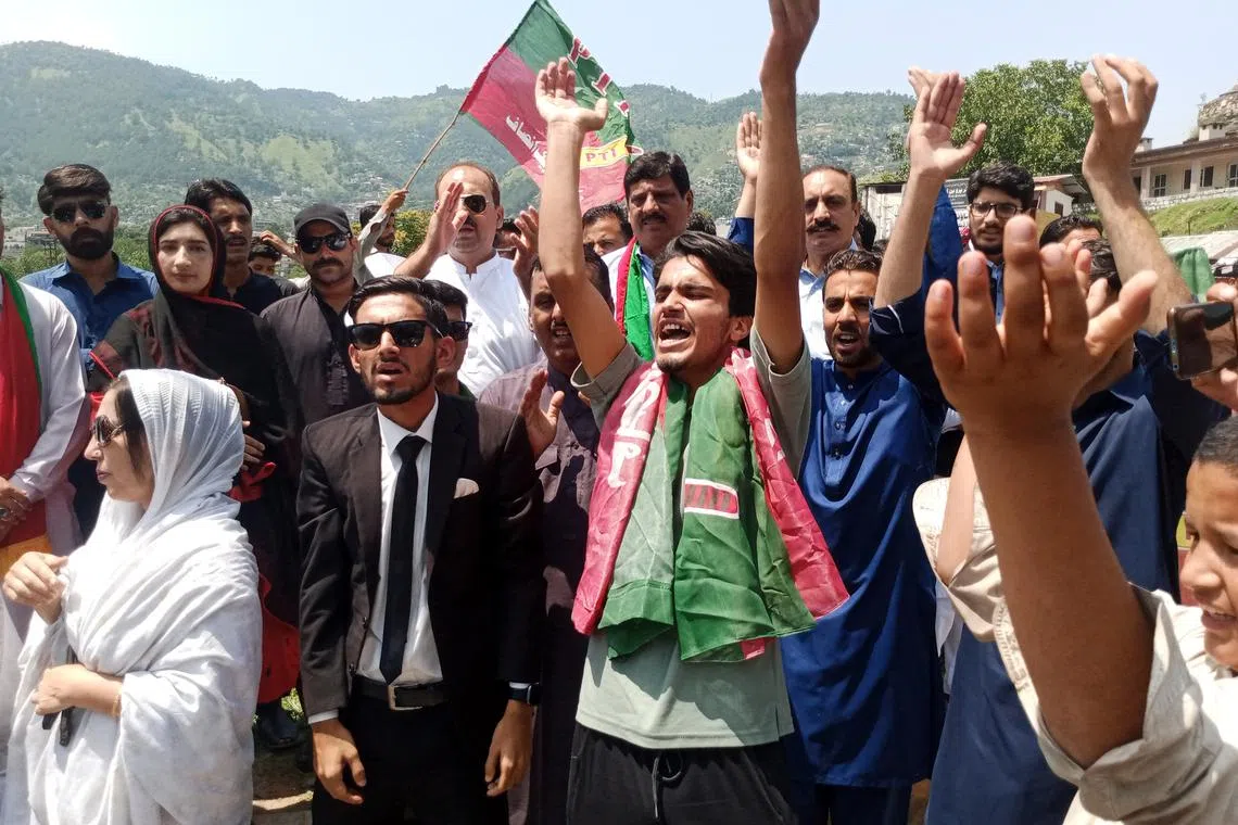 Supporters of former Pakistani PM Imran Khan protesting in Muzaffarabad, in Pakistan's Kashmir, on Aug 7, 2023.
