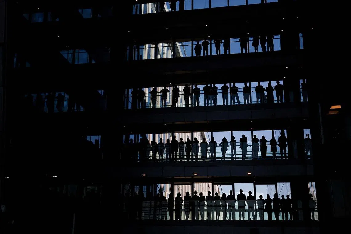 NATO staff watching a ceremony to mark the 70th anniversary of Germany's accession to NATO, at the NATO Headquarters in Brussels, Belgium April 28, 2025. 