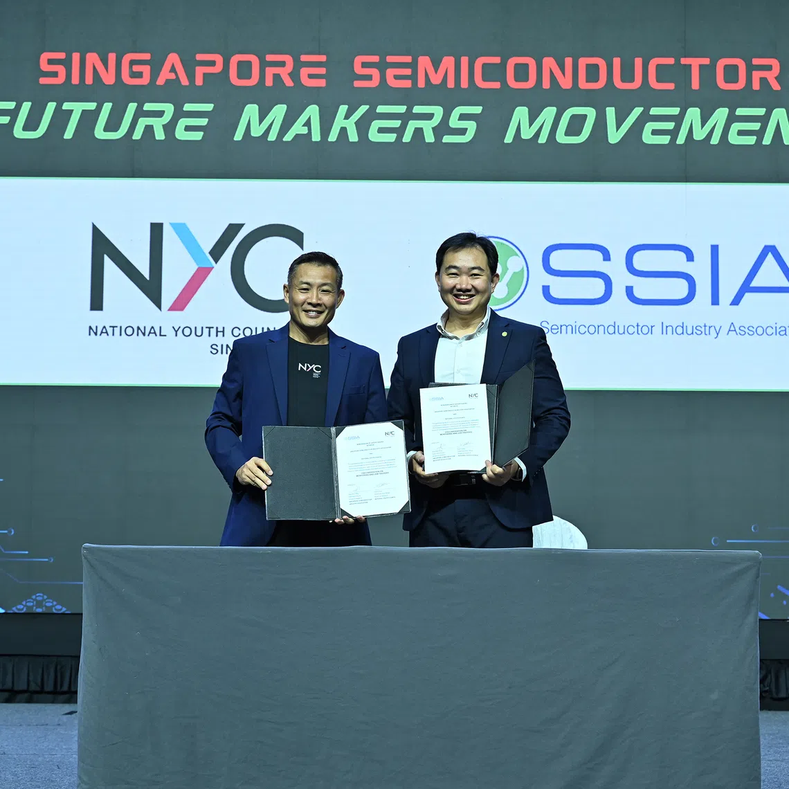 National Youth Council chief executive David Chua (left) and SSIA executive director Ang Wee Seng mark a three-year partnership to expand semiconductor industry exposure, Job Tasters and mentoring opportunities for young people.