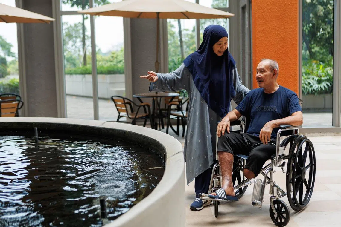 Ren Ci @ Woodlands resident Jumadi Sayap (right), 71, who has dementia, with his niece Hazwani Mohamad, 52. She uses $200 from her uncle’s MediSave account each month under the MediSave Care scheme to offset the nursing home’s fees.