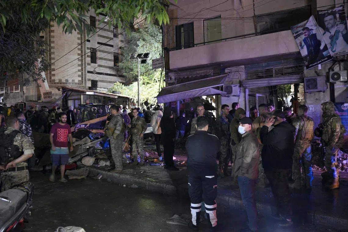 Local residents and Lebanese army personnel gathering at the site of an Israeli airstrike in the Zuqaq al-Blat district, in central Beirut on Nov 18. According to the Lebanese Ministry of Health, more than 3,400 people have been killed and over 14,700 others  injured in Lebanon since the escalation in hostilities between Israel and Hezbollah.  