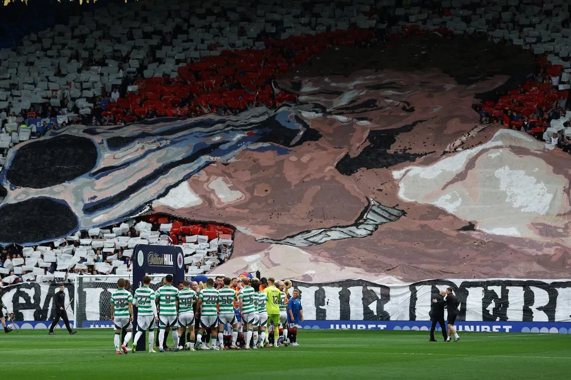 FILE PHOTO: Soccer Football - Scottish Premiership - Rangers v Celtic - Ibrox, Glasgow, Scotland, Britain - May 4, 2025 Rangers fans display a banner inside the stadium before the match Action Images via Reuters/Lee Smith/File Photo