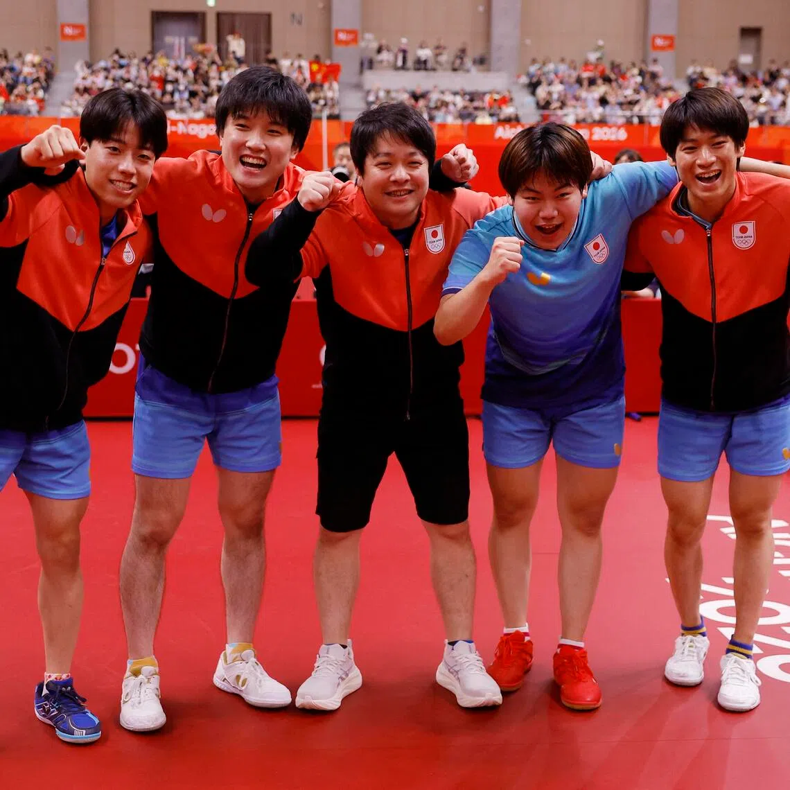 Japan’s Tomokazu Harimoto, Sora Matsushima, Shunsuke Togami, Hiroto Shinozuka and coach Seiya Kishikawa celebrate after winning the Asian Games table tennis men’s team final on Sept 24.