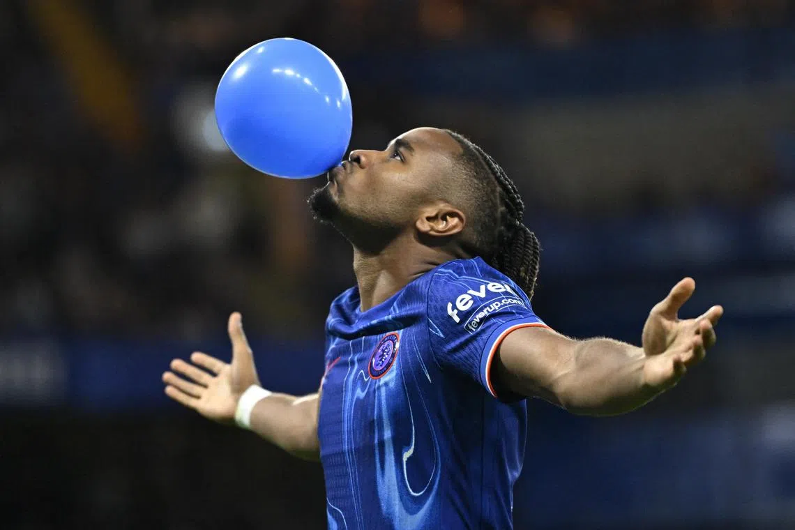 Chelsea's Christopher Nkunku celebrates scoring their first goal in their 2-0 win over Servette in the Europa Conference League play-off, first leg with a balloon.