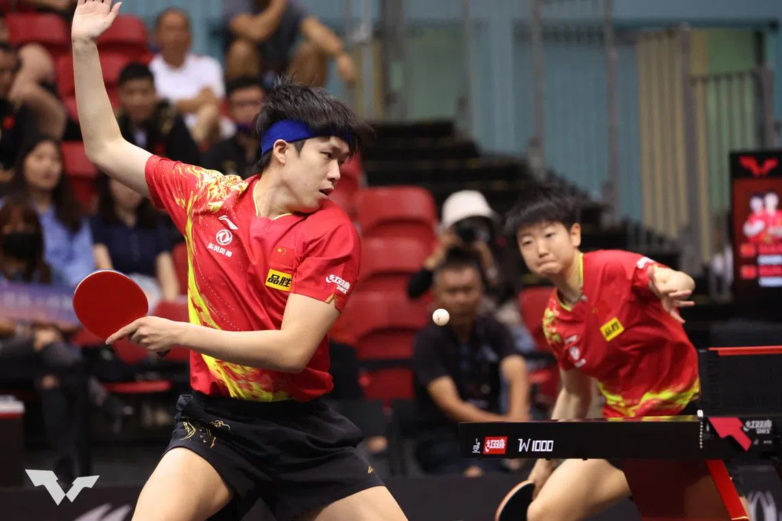 Wang Chuqin (left) and mixed doubles partner Sun Yingsha in action at the Singapore Smash 2023.
